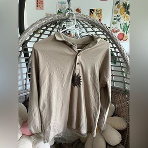 cream button up pullover with sun detail